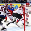 MINSK, BELARUS - MAY 17: Russia's Sergei Shirokov #52 scores a goal against Latvia's Kristers Gudlevskis #50 while Georgijs Pujacs #81 looks on during preliminary round action at the 2014 IIHF Ice Hockey World Championship. (Photo by Andre Ringuette/HHOF-IIHF Images)